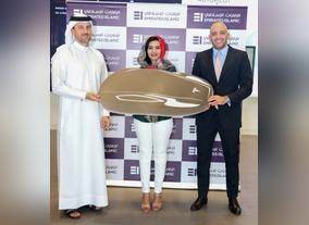 Tesla for Kunooz Account winner Azza Taha Mohammed Ahmed Taha, Emirates Islamic handed the keys
