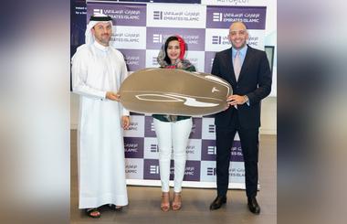 Tesla for Kunooz Account winner Azza Taha Mohammed Ahmed Taha, Emirates Islamic handed the keys
