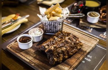 Enjoy the Theme Nights at Nezesaussi Grill in Manzil Downtown