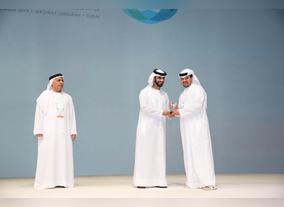Mansoor bin Mohammed presents to Falconcity of Wonders an appreciation award for sponsoring DIPMF