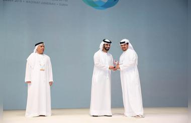 Mansoor bin Mohammed presents to Falconcity of Wonders an appreciation award for sponsoring DIPMF
