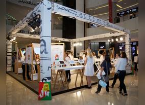 Women try out expert makeup techniques at DSFs MAC Instant Artistry 