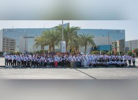 Dubai Investments Employees paint Ghaf leaf wall mural marking the Year of Tolerance